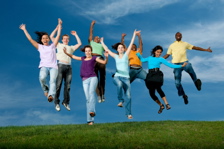 Image: Group of youth jumping in the air together.