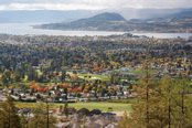 Image: City of Kelowna with fall colors, lake & mountain.